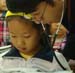 Dr Zhang examines child